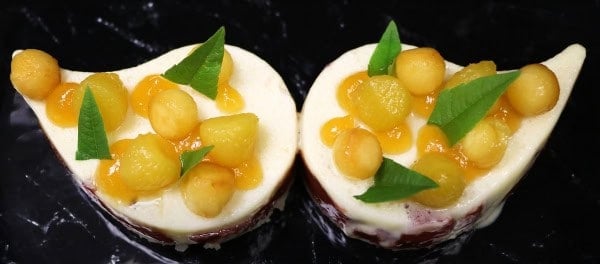 Peach dessert in the shape of a moustache