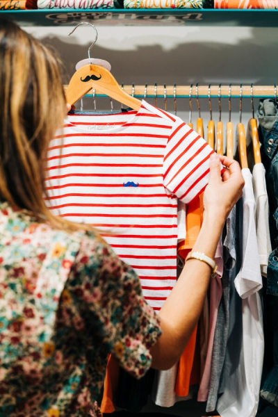 View of a customer from behind looking for items from the 100% Gaillard Boutique during the sales