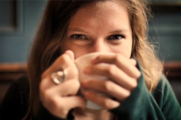 young girl enjoying a cup of tea